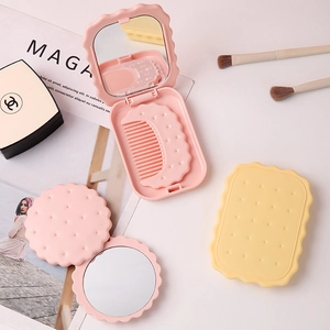 Cookie shaped portable mirror and comb set in cute pink and yellow designs