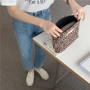 Detail of leopard print canvas makeup bag showing the large capacity and zipper closure