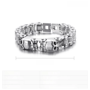 Macro shot of stainless steel skull bike chain bracelet showing punk gothic details