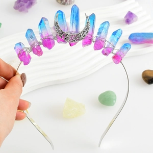 Detail of handmade blue-purple crystal crown with silver moon on a metal headband