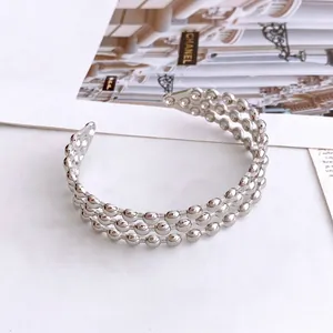 Chic silver triple-layer beaded open bangle bracelet for women in a stylish 45-degree view