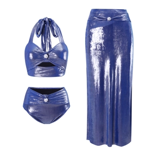 Detail of metallic blue bikini and matching sarong skirt with elegant white pearl accents