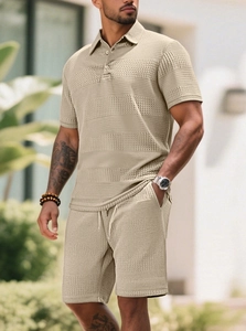 Close-up of beige knit waffle texture on men's short sleeve polo and shorts set
