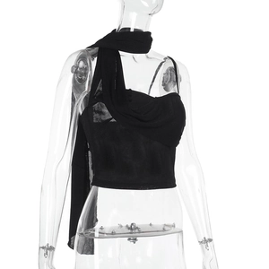 Detail of black halter neck crop top featuring draped mesh fabric on a transparent mannequin