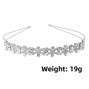 Detail view of silver bridal headband with rhinestones and flower motif, weighing 19g