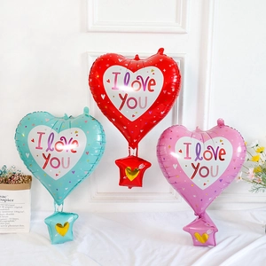 Detailed view of heart-shaped hot air balloon foil balloons in red, blue, and pink colors