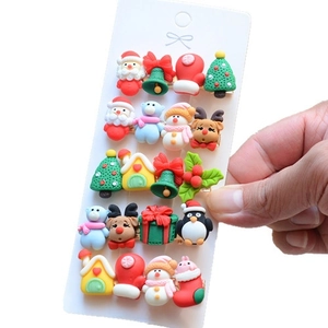 Close-up of 20-piece Christmas hair clips set with Santa and reindeer on card