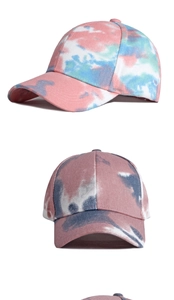 Close-up of vibrant cotton tie-dye baseball caps featuring unique artistic splash patterns