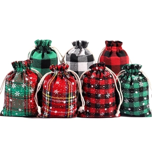 Christmas plaid cotton drawstring gift bags with snowflake patterns in various festive colors