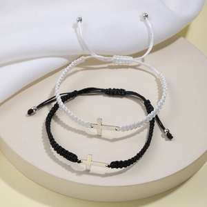 Adjustable black and white handmade woven friendship bracelets with silver cross pendants