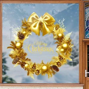 Golden Christmas wreath window sticker with Merry Christmas text on wooden window frame
