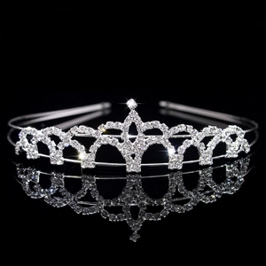 Macro shot of sparkling silver rhinestone crown headband with reflective mirror base