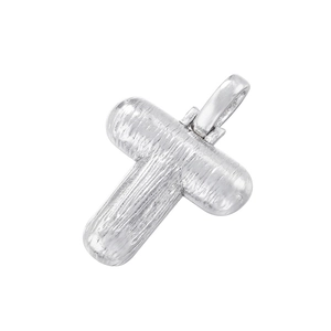 Macro view of textured silver cross pendant with top hanging loop on white background