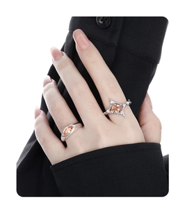 Close-up of S925 silver square star ring with orange gemstones on model hands