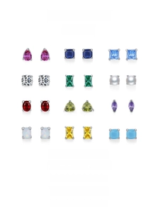 Macro view of twelve assorted gemstone stud earrings in various cuts and vibrant colors