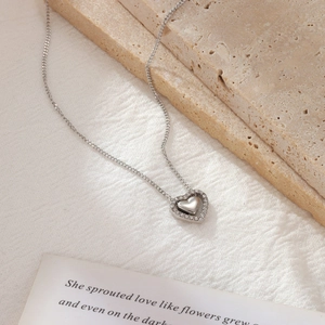 Elegant heart pendant necklace in polished titanium steel with micro-pave crystals
