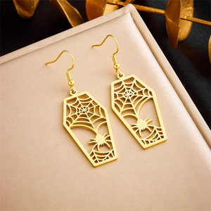 Detail shot of gold hollow coffin earrings with spider web design and hook backing
