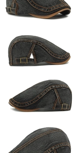 Detailed close-up of washed denim beret with orange contrast stitching and metal buckle