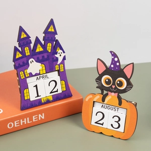 Macro shot of Halloween wooden countdown calendar with pumpkin and ghost motifs on desk