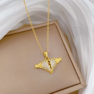 Luxury gold titanium broken heart necklace with wings and shimmering pavé zircons