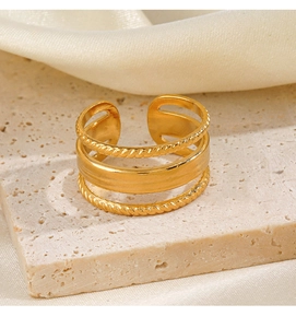 Detail of 18K gold-plated triple-layered adjustable open ring with twisted texture