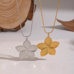 French vintage flower pendant necklace in gold and silver steel with petal texture