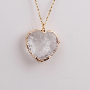 Faceted irregular crystal heart pendant on golden twist chain necklace for women
