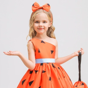 Detail of girls orange pumpkin dress with black triangles and blue belt for Halloween