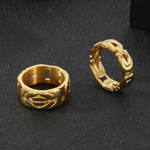 Macro detail of gold Byzantine chain texture on high-polished stainless steel rings