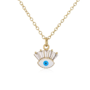 Close-up of 18K gold plated evil eye pendant with blue enamel and rectangular zircon