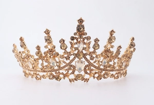 Detail view of golden wedding crown with sparkling brown rhinestones and crystals