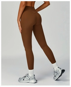 Detail showing the seamless high waist fit and brown sculpting fabric of the yoga leggings