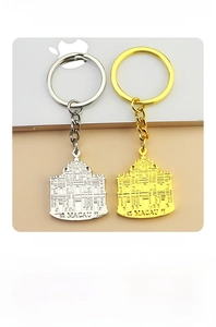 Detailed close-up of double-sided relief Macau Ruins of St. Paul's souvenir keychain