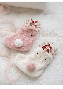 Pink and beige plush reindeer Christmas stockings with glitter antlers on white fur background