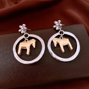 Luxury silver floral earrings with round hollow hoop and golden horse pendant charms