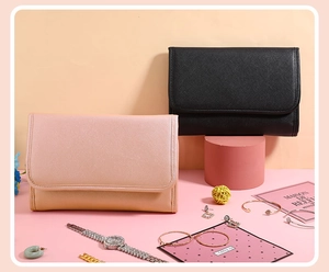 Pink and black portable jewelry organizers with multiple compartments for safe storage