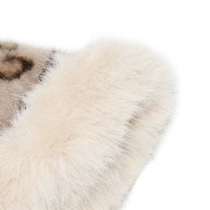 Detail of luxury white faux fur texture with classic brown monogram canvas pattern