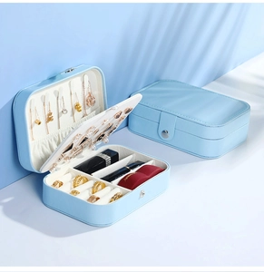 Close-up of light blue PU leather jewelry box showing double-layer storage compartments