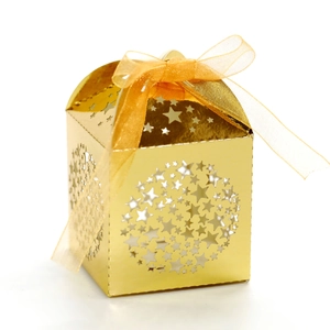 Golden laser-cut star favor box with orange ribbon bow for holiday celebrations