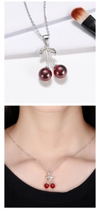 Detailed close-up and model shot of a s925 silver cherry necklace with deep red pendant
