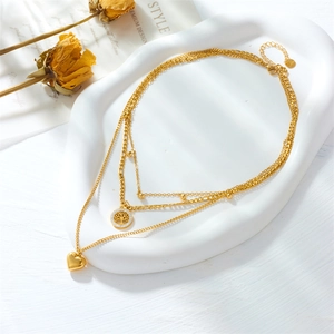 Multi-layer gold stainless steel necklace with heart and tree of life pendants