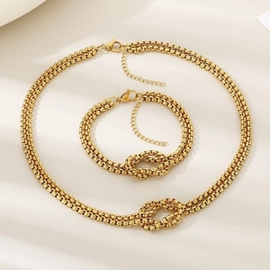 Exaggerated geometric stainless steel knot jewelry set with pearls and gold finish