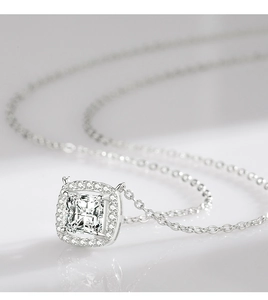 Macro shot of silver square pendant featuring sparkling cubic zirconia on a delicate chain
