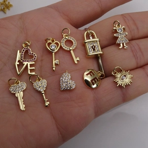 Gold star moon pendants with cubic zirconia for jewelry making held in hand