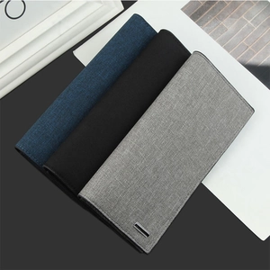 Detailed view of canvas long wallets for men in navy blue, black and grey fabric textures