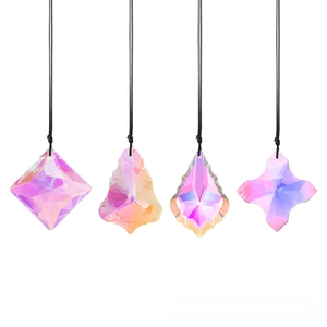 Detail of four crystal suncatchers with AB aurora coating and black hanging cords