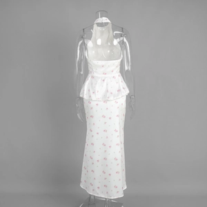 Detail of the white floral halter maxi skirt set showing the peplum waist and back view