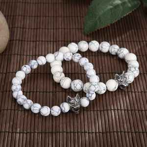 Wolf head beaded bracelet with natural white turquoise stones and silver metal accents