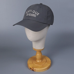 Detail of grey quick-dry nylon baseball cap with white Antique Old-Fashioned embroidery