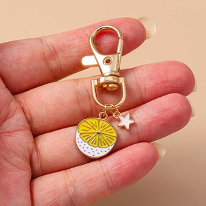 Cute lemon slice keychain with a small star charm, gold-tone metal ring for backpacks